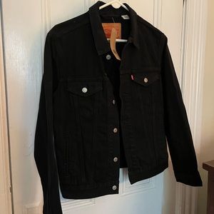 Levi's black jean jacket. Men's small (fits woman like a medium). Never worn.
